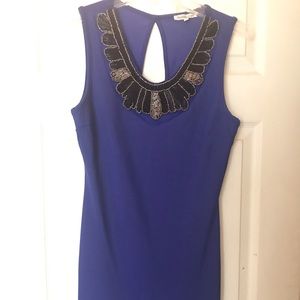 Short blue cocktail with beadwork.